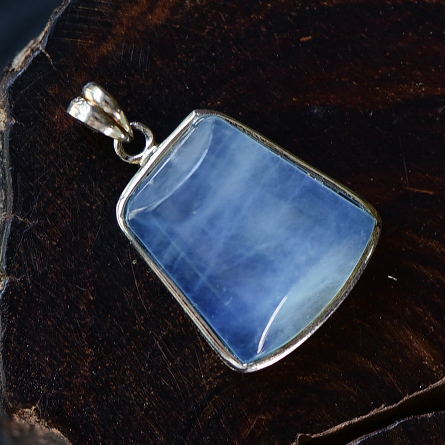 A natural aquamarine stone visible from the top